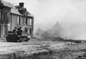 British advance south of Caumont. A Bren gun crew move cautiously forward through