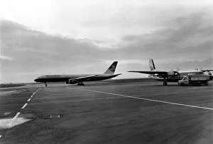 Business Travel Prints: A British Airways 757 taxis past an Air UK Fokker F27 at Heathrow Airport