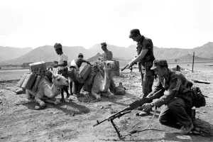 British Army in Aden with locals and camels. April 1966 W4001b