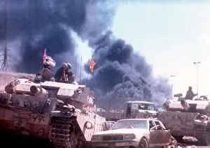 Pollution Prints: British army engineers use armoured vehicles to clear the road to Kuwait City