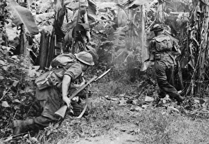 Far East Prints: A British Army jungle patrol attacks a native Basha, a bamboo hut