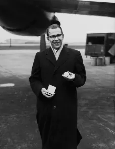 Hero Prints: British athlete Chris Brasher shows off his gold medal which he won at the 1956 Olympic