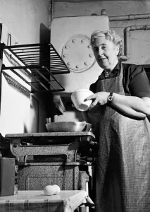 British author Agatha Christie pictured cooking in the kitchen at her home at Winterbrook