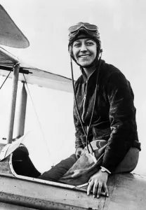 00927 Prints: British aviator Amy Johnson pictured in the cockpit of her Gipsy Moth plane before before