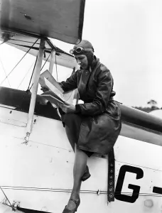 00927 Prints: British aviator Amy Johnson pictured in the cockpit of her Gipsy Moth plane before taking