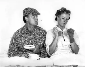 Ashtray Prints: The British at bed time. Husband and wife similar to Andy Capp and Flo seen here in bed