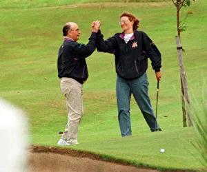 British billionaire Joe Lewis July 1997 on golf course at Turnberry Hotel high five