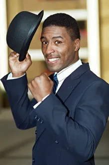 Top Hat Prints: British boxer Michael Watson posing in suite and top hat ahead of his WBA title fight