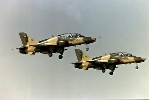 Middle East Prints: The British built trainer jet BAE Hawk of the Royal Saudi Air Force take off side by side