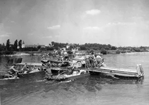 British and Canadian troops crossing the River Seine at Elbeuf in Normandy