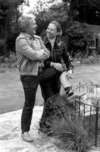 British comedian Ernie Wise showing off his fat hairy legs to his wife. June 1980