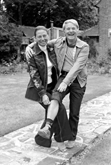 Couples Prints: British comedian Ernie Wise showing off his fat hairy legs to his wife. June 1980