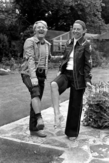 British comedian Ernie Wise showing off his fat hairy legs to his wife. June 1980