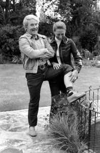 British comedian Ernie Wise showing off his fat hairy legs to his wife. June 1980