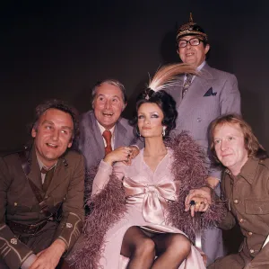 British comedy duo Ernie Wise and Eric Morecambe pose with John Thaw