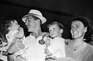 00928 Prints: British cyclist Chris Boardman poses with his family on arrival at Manchester airport as
