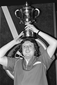 01164 Prints: British dart player Eric Bristow celebrates his victory in the Embassy Darts World