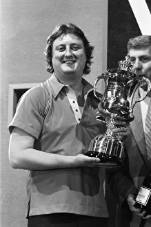 01164 Prints: British dart player Eric Bristow celebrates his victory in the Embassy Darts World