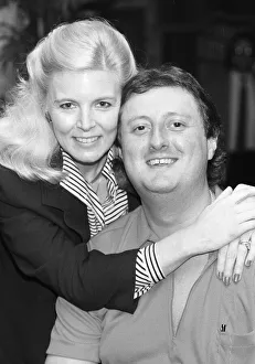 British dart player Eric Bristow poses with Maureen Flowers at the Embassy World