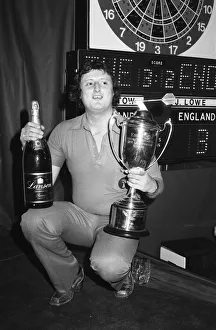 British darts player Eric Bristow celebrates his victory over John Lowe in the Final of