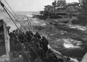 The British destroyer HMS Fury refuels from the cruiser HMS Trinidad despite heavy seas