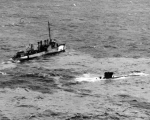 01452 Prints: British destroyer standing by to take possession of U-boat captured by RAF