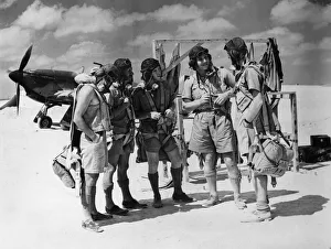 North Africa Prints: British fighter pilots in the Western desert have a conference before going on patrol in