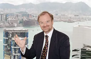 Asia Prints: British Foreign Secretary Robin Cook pictured in his hotel suite on the 51st floor of