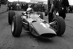 00197 Prints: British Grand Prix 1965 Silverstone July 1965 John Surtees sits in his Ferrari