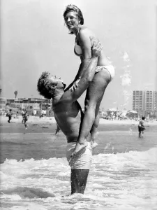 British heavyweight boxer Joe Bugner and Morlin Carter playing in the sea