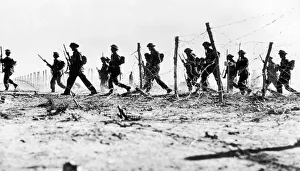Barbed Wire Prints: British infantry making their wat through a gap in the barbed wire defences during