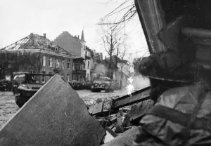 01462 Prints: A British infantryman takes cover under the ruins of a building in Kleve