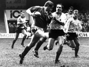 British Lions Prints: British Lions v Rest of The World. Trevor Ringland powers clear despite the close