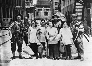 British Marines and Sailor Tommy gunners made a preliminary landing in the dockyard of