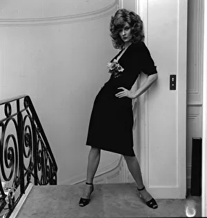 High Heels Prints: British model Vicki Hodge wearing black clingy dress with plunging neck line with posy