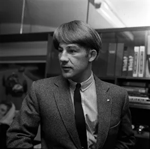 British motor racing driver Stirling Moss wearing a Beatles wig, November 1963