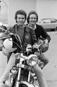Rider Prints: British Motorcycle road racer Barry Sheene with pop singer David Essex at the Motorcycle