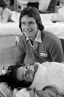 00964 Prints: British Motorcycle road racer Barry Sheene with young fan Tony Vickers who is undergoing