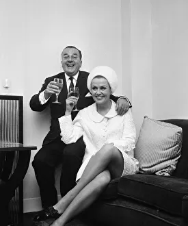 Man And Woman Prints: British musician Ronnie Ronalde toasts his new bride Yana after their wedding ceremony