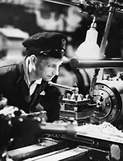 Craftsman Prints: British Naval Factory a Float. Typical young E. R. A at work in the light machine