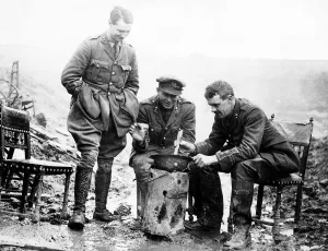 British officers cook a casserole in an army helmet 1917 during World War One