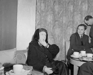 00118 Prints: British Poet Dame Edith Louisa Sitwell seen here with her book Fanfare for Elizabeth at a