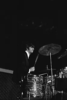 British pop group The Beatles performing on stage at the Cow Palace in San Francisco