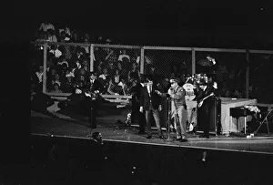 British pop group The Beatles performing on stage at the Cow Palace in San Francisco
