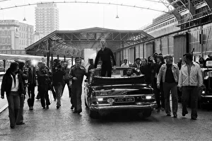 British pop singer David Bowie arrives home at Victoria Station