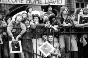British pop singer David Bowie arrives home at Victoria Station