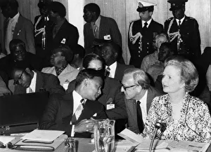 01428 Prints: British Prime Minister Margaret Thatcher with Lord Carrington talking to Joshua Nkomo