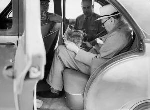 00363 Prints: British Prime Minister Winston Churchill with American officers studying aerial