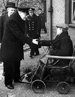 British Prime Minister Winston Churchill gives a handshake to Mr Thompson of Sandyhills