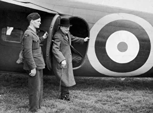 Walking Stick Prints: British Prime minister Winston Churchill leaves his aeroplane for a visit to a defence